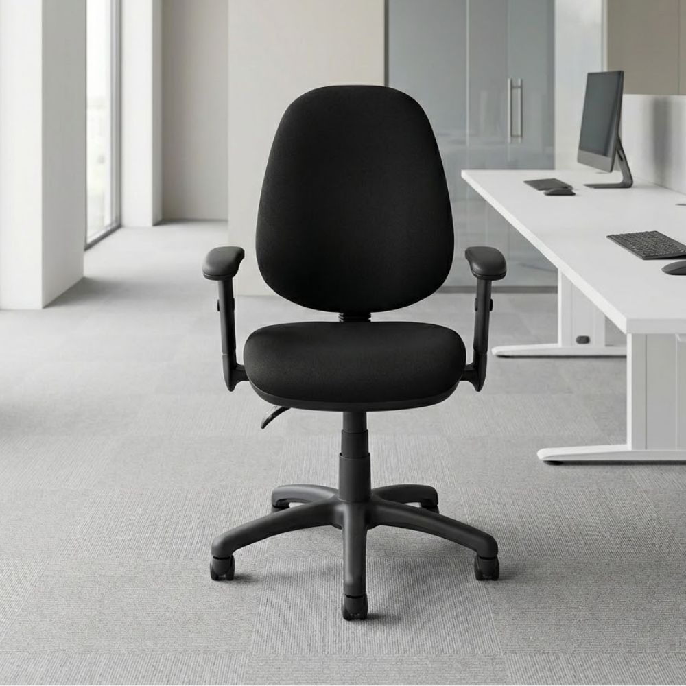 Black 2-lever operator's office chair with height-adjustable arms and EN 1335 certification, positioned in a bright modern workspace beside a white desk setup.