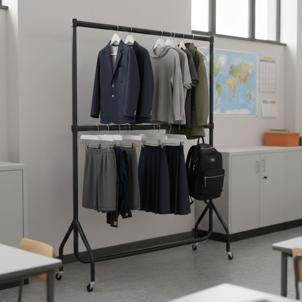 Black 6ft two-tier wheeled clothes rail displaying school uniforms including blazers, skirts and tops on hangers in a classroom environment.