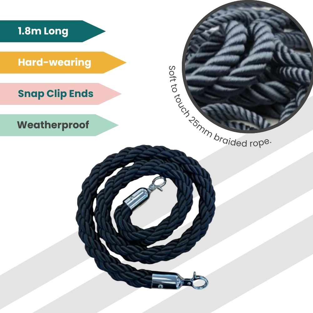 Coiled black rope with braided texture and gold clips, designed for outdoor queue management.