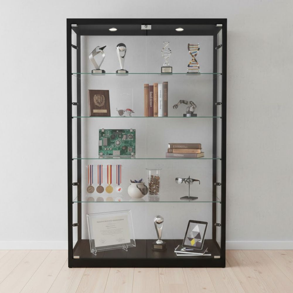 Black framed glass display cabinet showcasing trophies, medals, certificates, books, technology components and academic achievements arranged across multiple illuminated shelves.