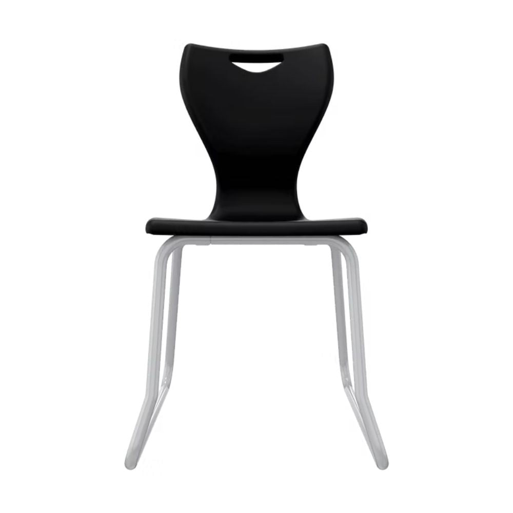 A sleek black secondary school chair featuring an abrasion-resistant polypropylene shell and a floor-cradle steel skid frame for maximum stability.