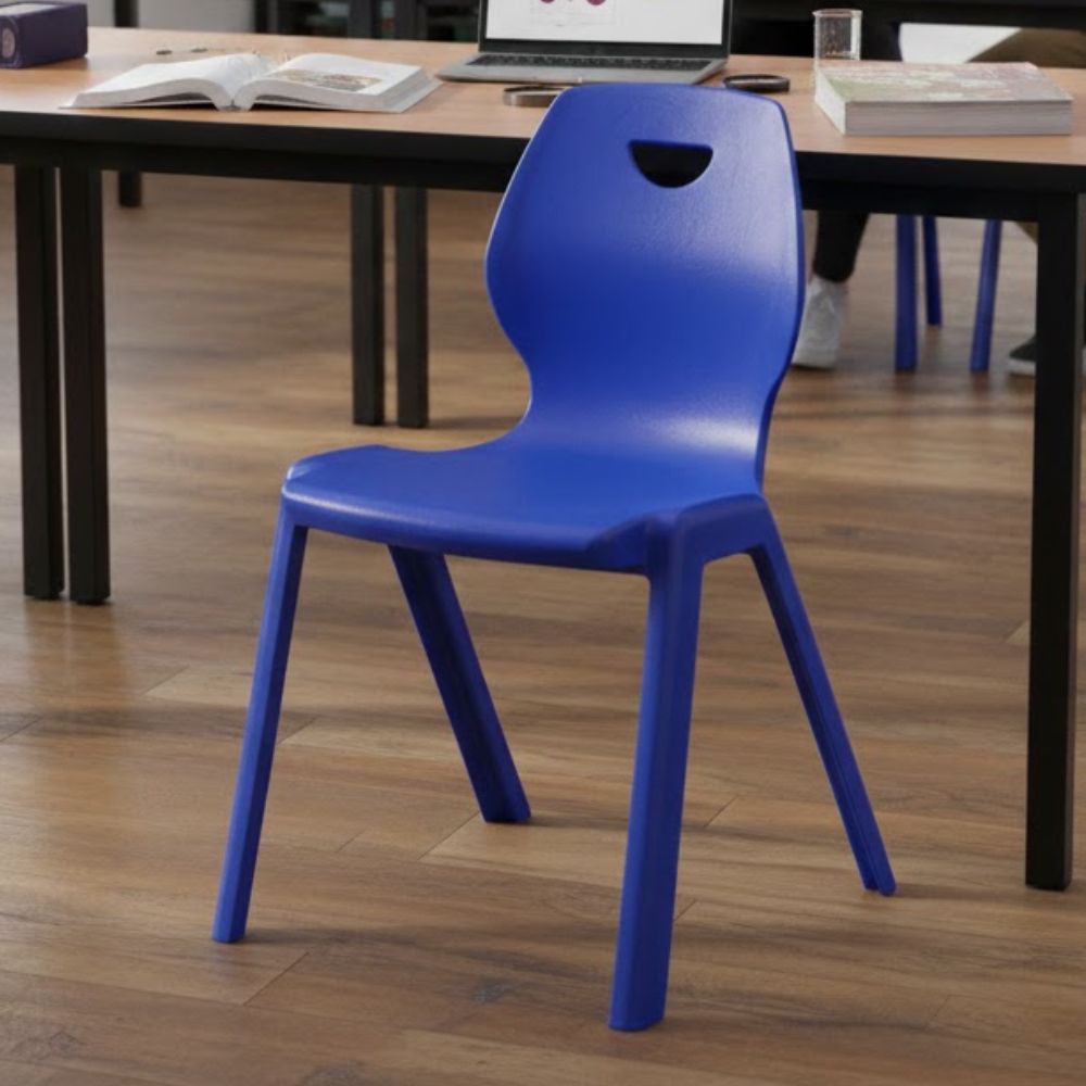 Ergonomic blue plastic chair with curved backrest and handle cutout for study and office environments.