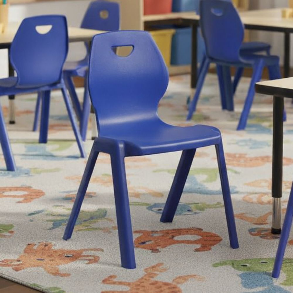 Blue plastic classroom chairs with cut-out handles and contoured seats for preschool environments.