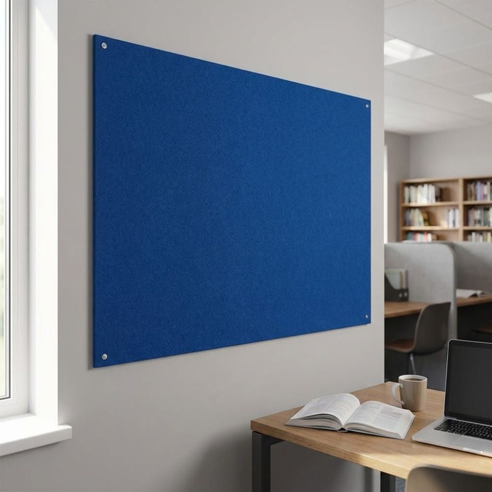 Blue unframed felt noticeboard measuring 1200mm x 900mm, wall mounted with visible corner fixings in a modern office workspace.