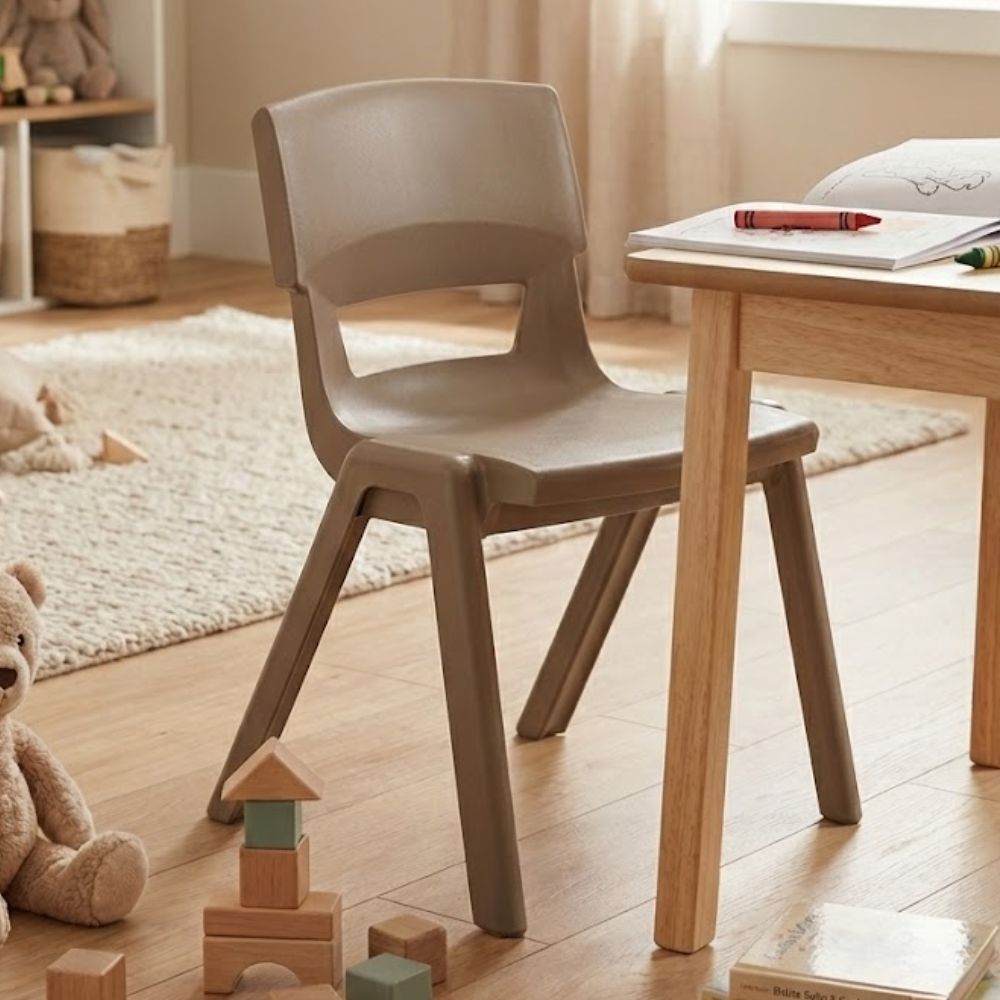 
Brown plastic chair in a cozy playroom with notebook, teddy bear, and wooden building blocks
