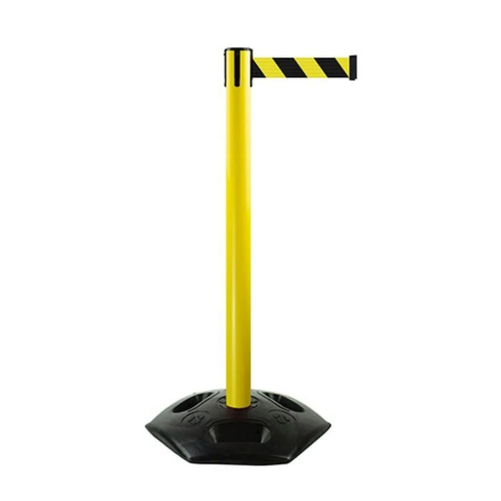 Yellow stanchion with black-and-yellow retractable belt and weighted rubber base for high-visibility safety barriers in public spaces.
