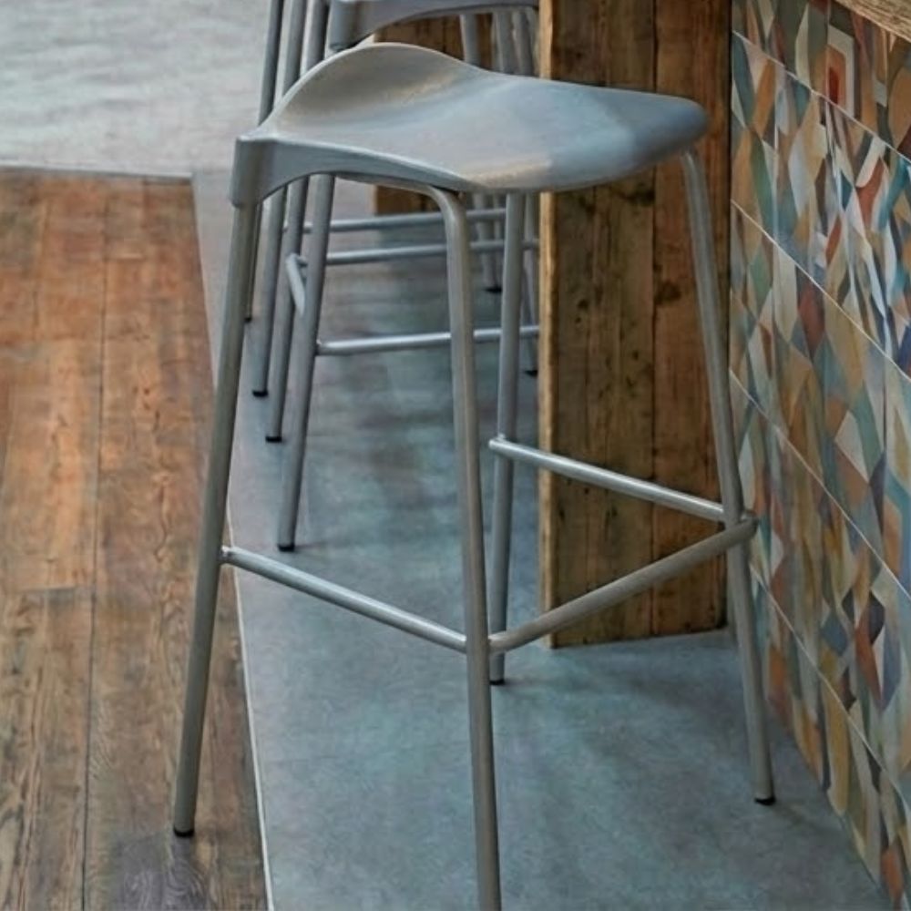 A grey classic 4-legged stacking stool with a 685mm seat height and silver steel frame, designed for use at high-level university laboratory benches and drafting tables.