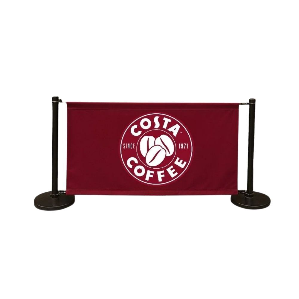 Costa Coffee banner with circular logo and black stanchions, used for branded crowd control in café environments.