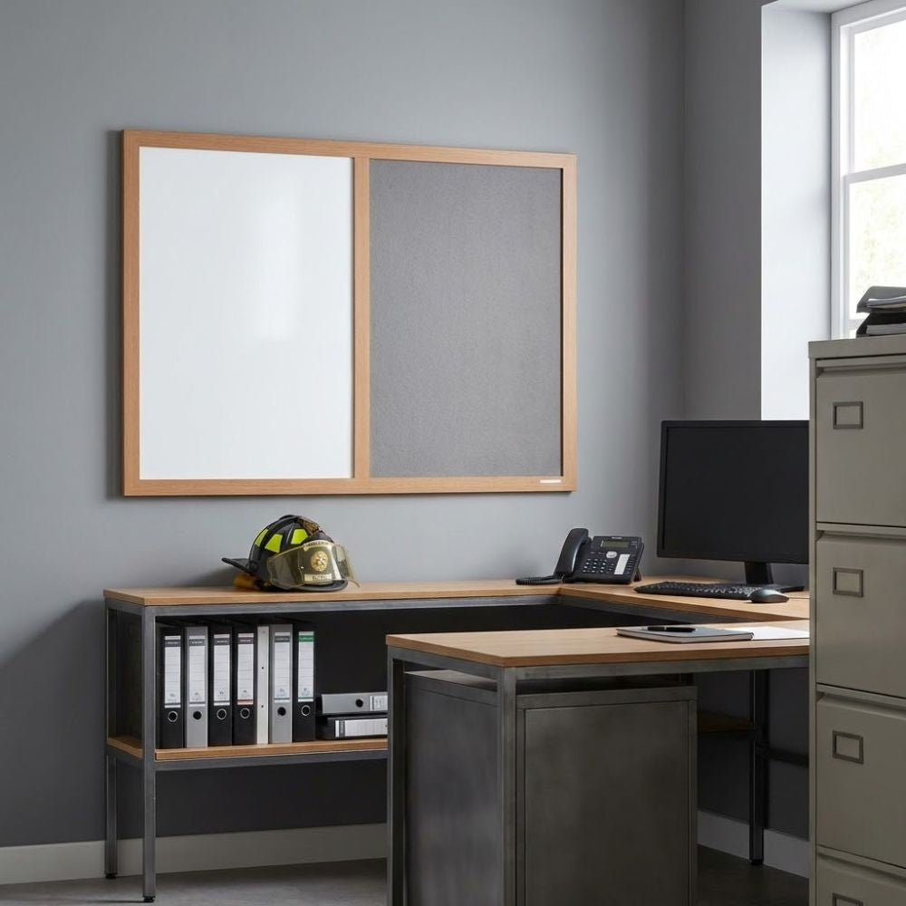 Eco-friendly 600 x 900mm combination board featuring a grey felt panel and whiteboard surface in a wooden frame, displayed above an office desk with computer and filing cabinets.