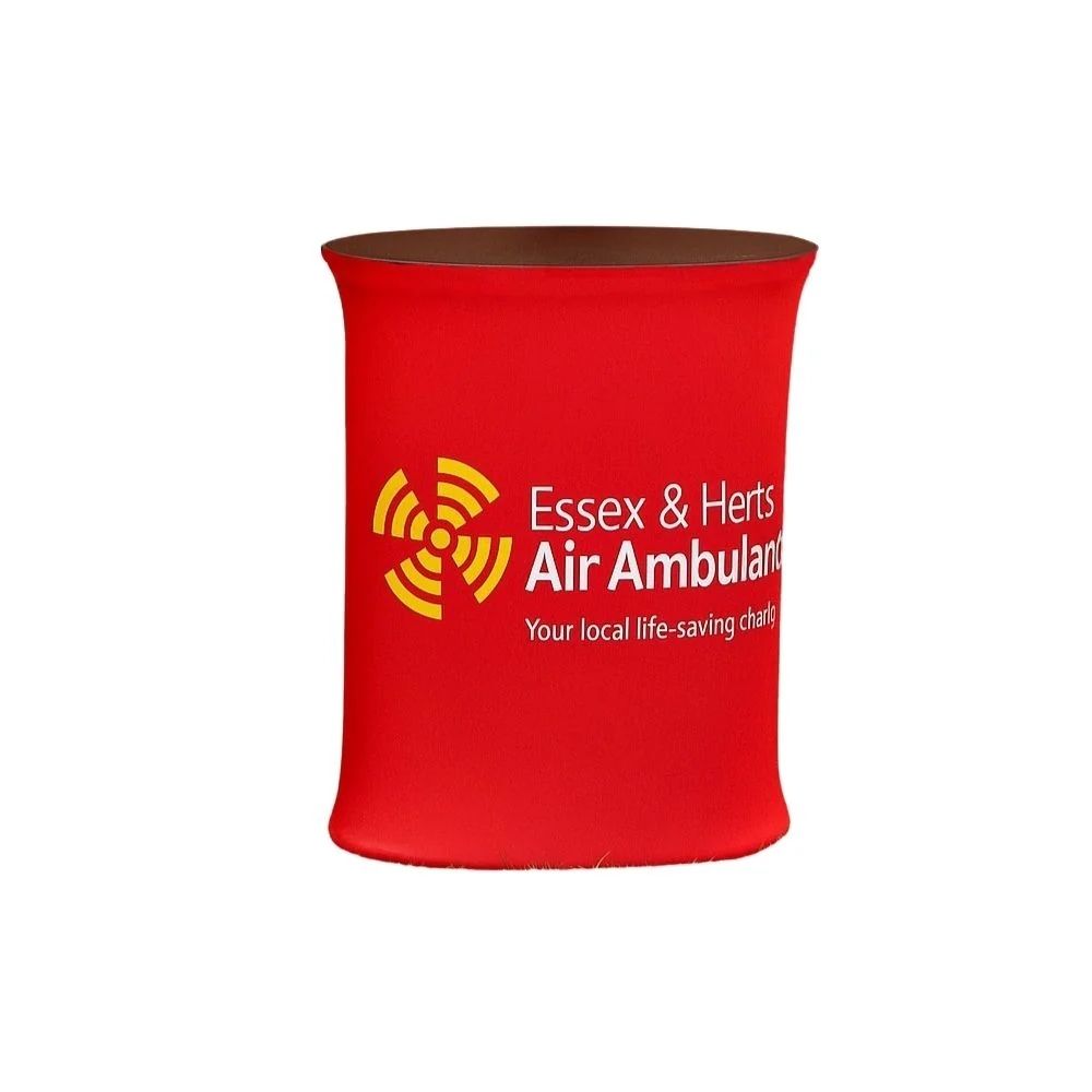 Red cylindrical counter with Essex & Herts Air Ambulance logo and tagline, ideal for charity events and public engagement.