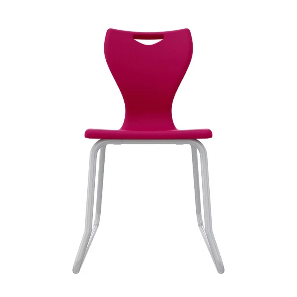A vibrant fuchsia pink secondary school chair with a wrap-around steel skid base, providing advanced stability and floor protection for older student classrooms.