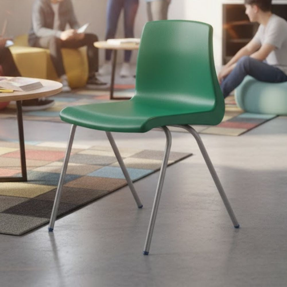 Green plastic chair with metal legs and ergonomic design, suitable for casual or collaborative learning spaces.