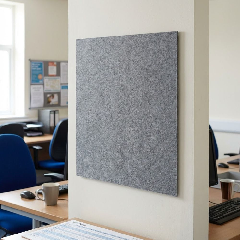Grey unframed felt noticeboard measuring 1200mm x 900mm, wide wall mounted board positioned above a desk in a professional office setting.