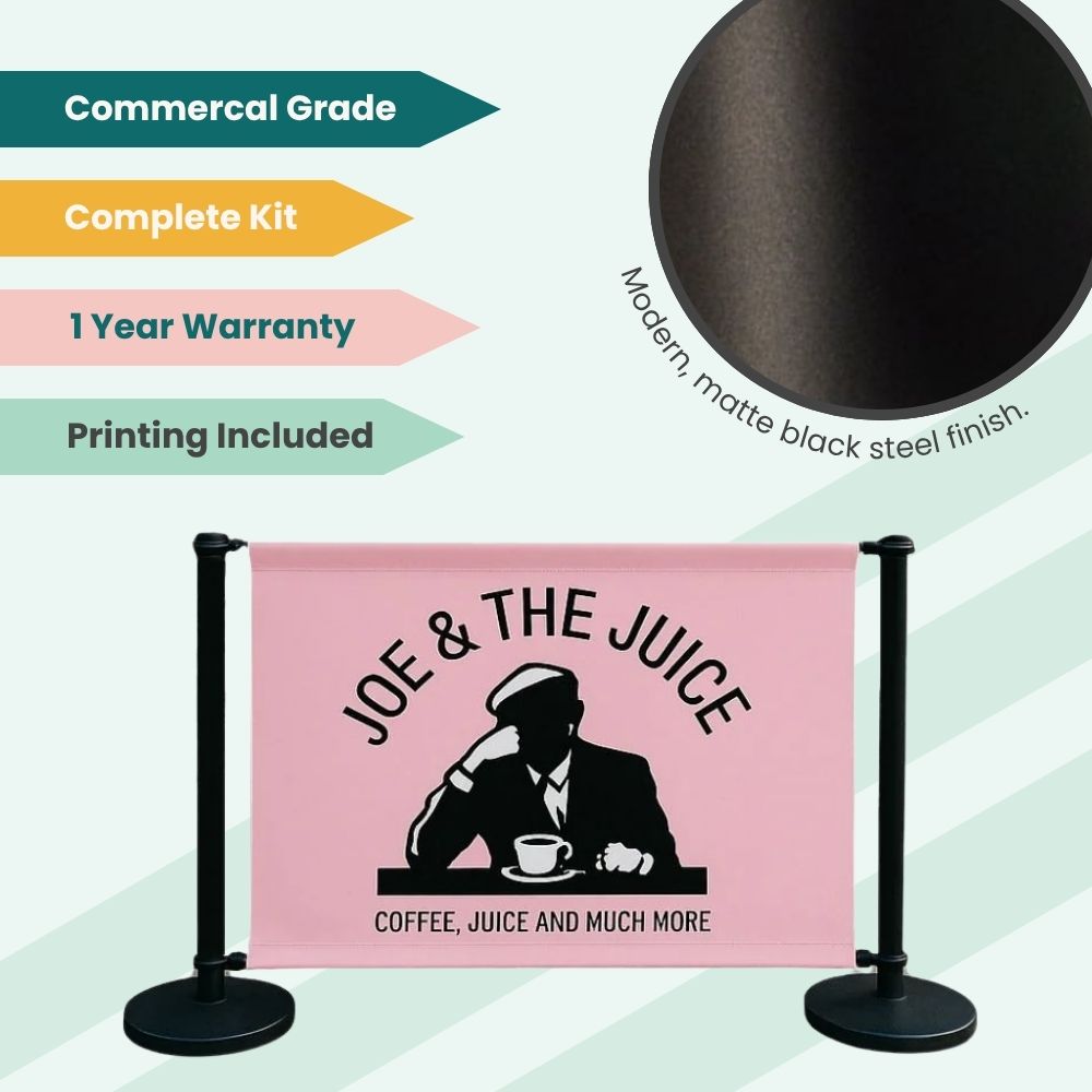 Joe & The Juice branded barrier with matte black stanchions and printed banner, highlighting commercial-grade durability and included printing.