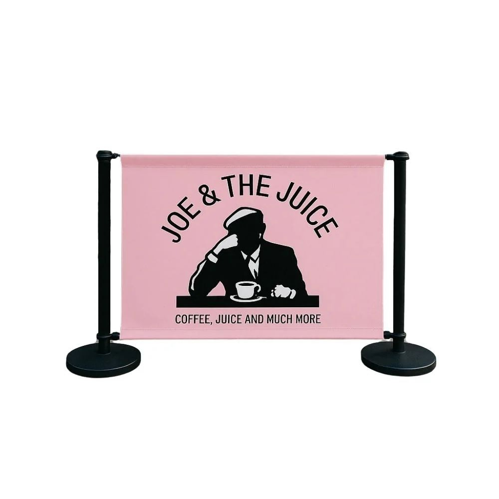 Pink Joe & The Juice banner with silhouette logo and black stanchions, perfect for stylish café branding and crowd control.