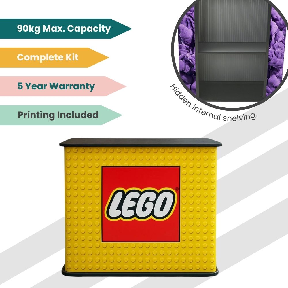 LEGO branded counter with stud-textured yellow panel, black top, hidden internal shelving, and 90kg capacity for retail or event use.