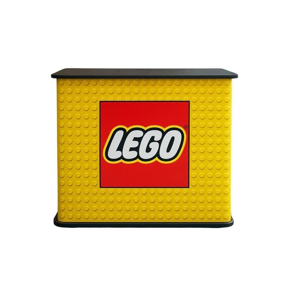 Yellow LEGO display stand with stud-textured front and central logo, ideal for retail environments or promotional setups.
