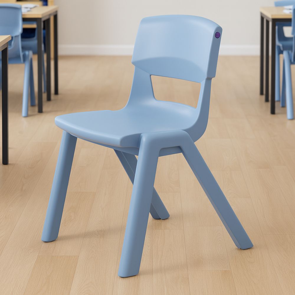 A light blue student chair on a wooden laminate floor in a classic classroom setup, surrounded by black-framed desks and chairs.
