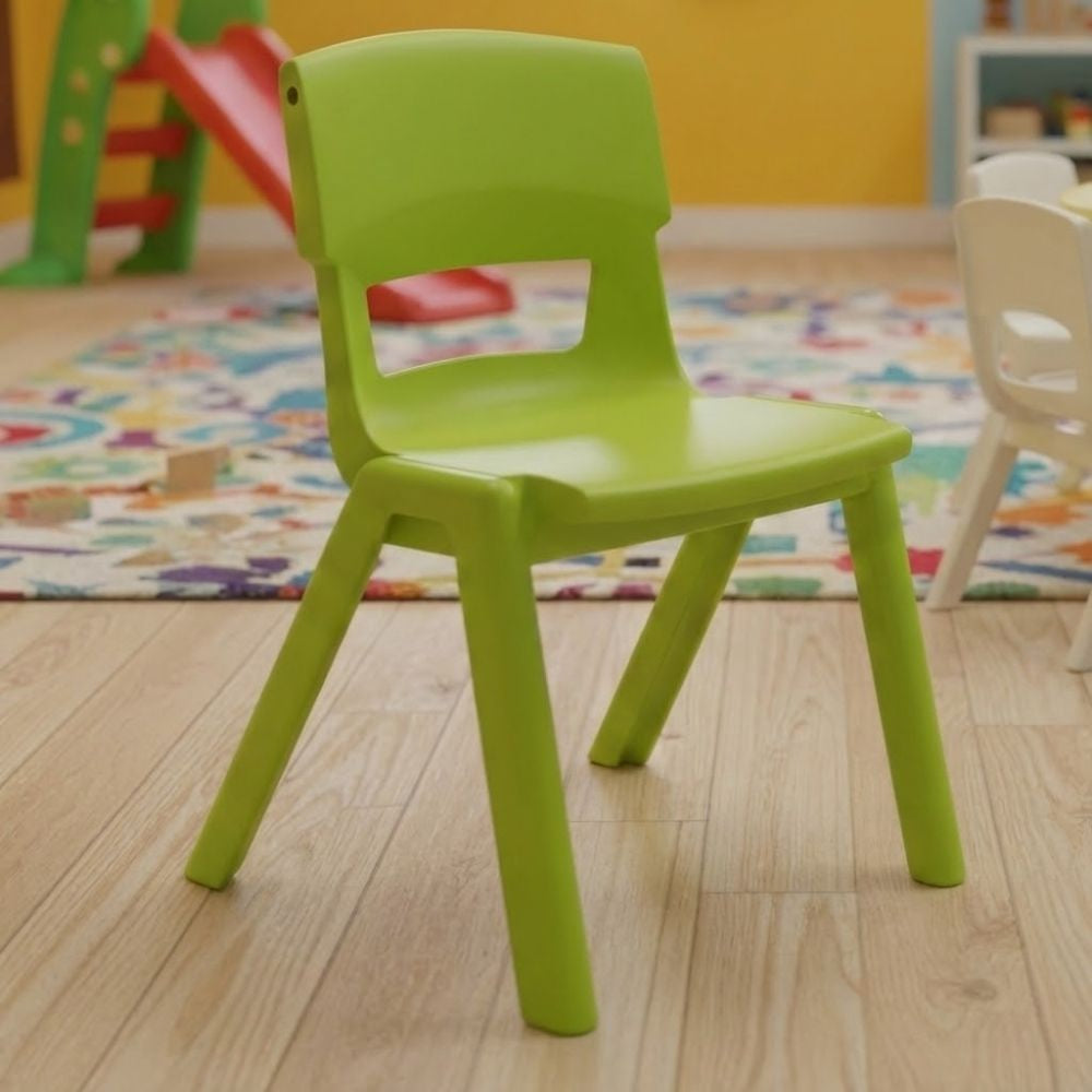 A lime green nursery chair positioned on wooden flooring in a playful setting, with a bright rug, red slide and educational toys in the background.
