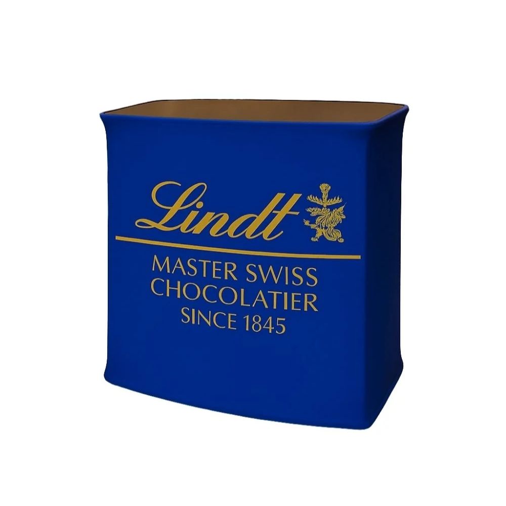Blue Lindt promotional stand with gold logo and emblem featuring a dragon-like creature, ideal for premium chocolate branding at events or retail.