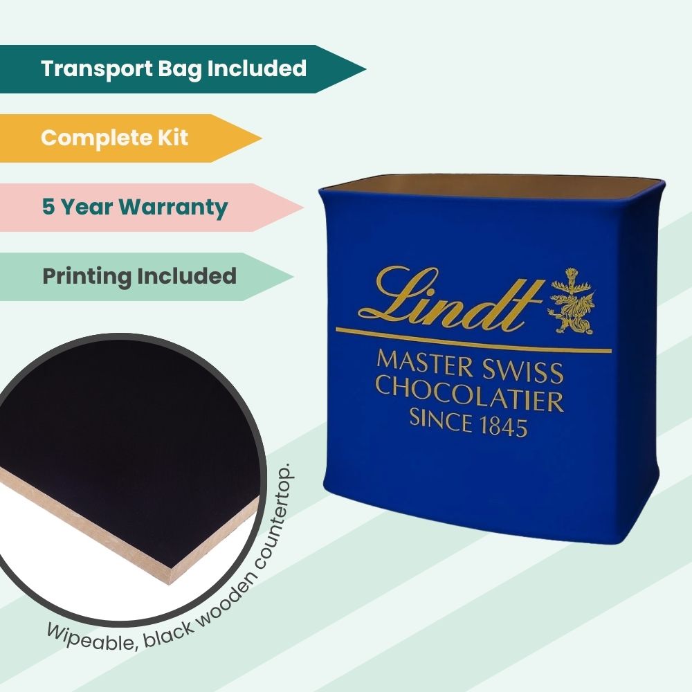 Lindt branded counter with blue wrap and gold logo, featuring wipeable black top, transport bag, and 5-year warranty for marketing use.