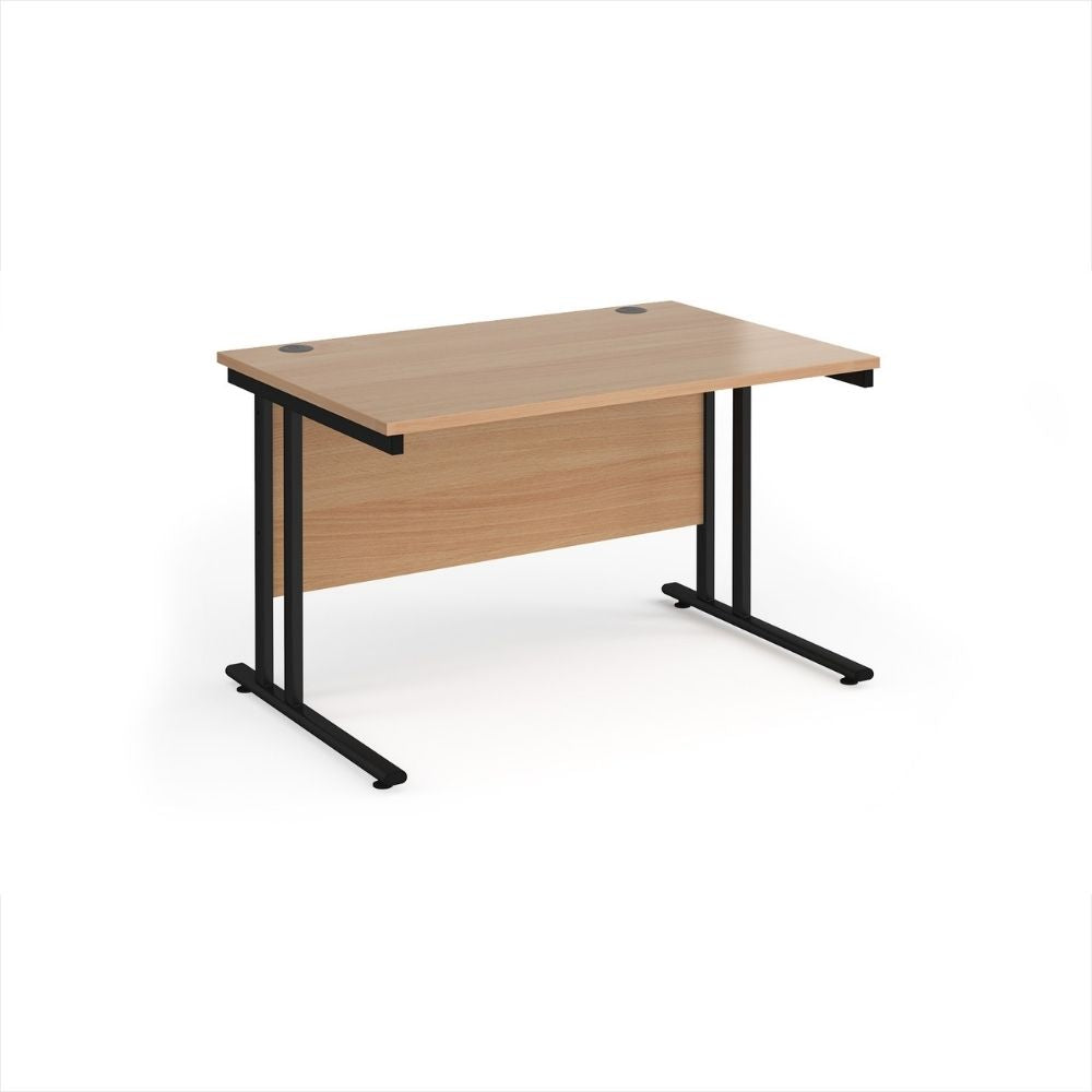 Medium sized office desk with a light wood effect work surface, full width modesty panel, dual cable access ports and black metal leg frame for professional workspaces