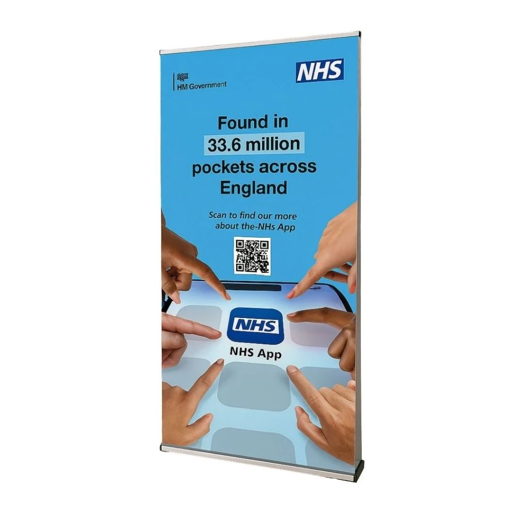 NHS App banner stand with smartphone graphic and QR code, highlighting mobile health access.