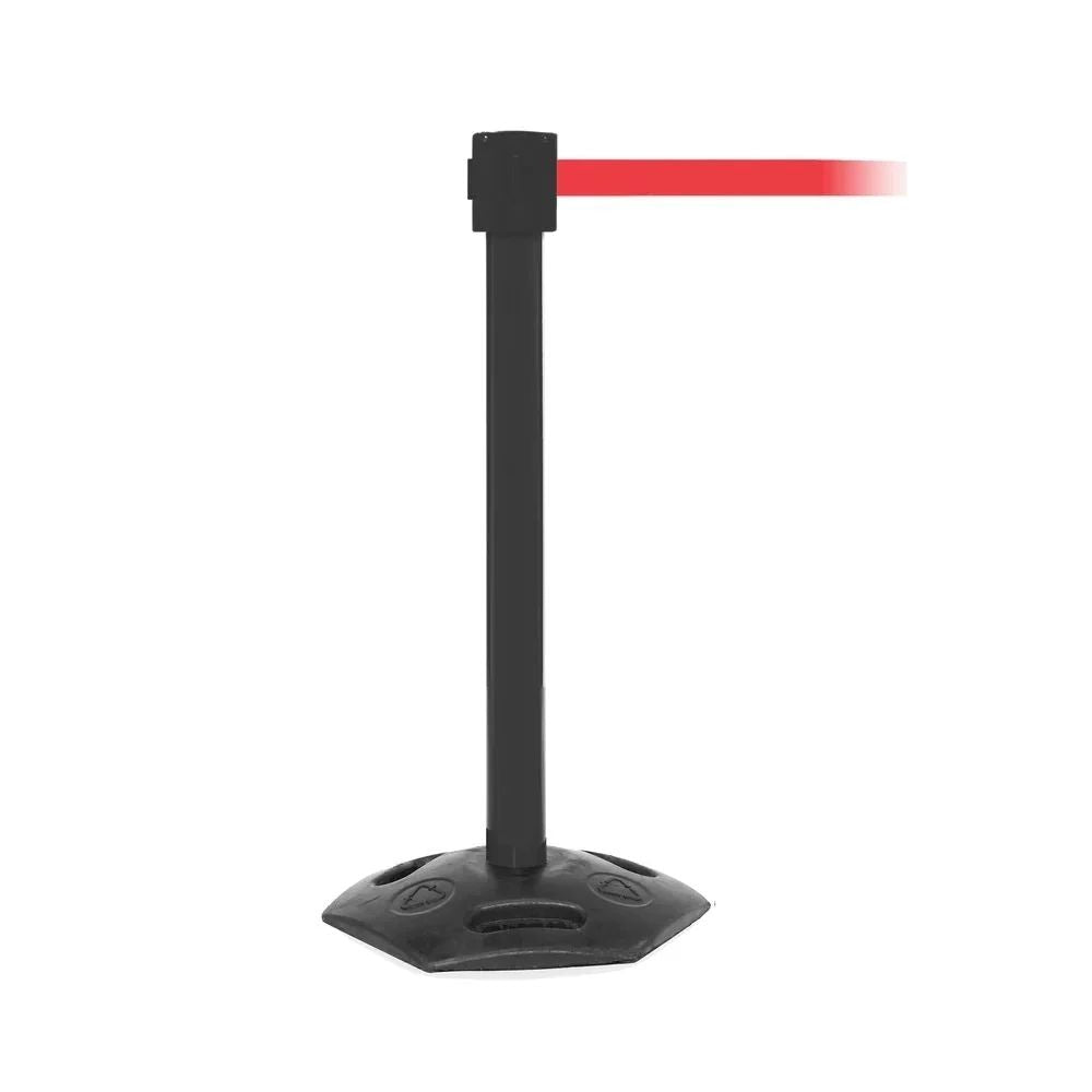 Black stanchion with red retractable belt and hexagonal base for guiding pedestrian traffic in busy environments.