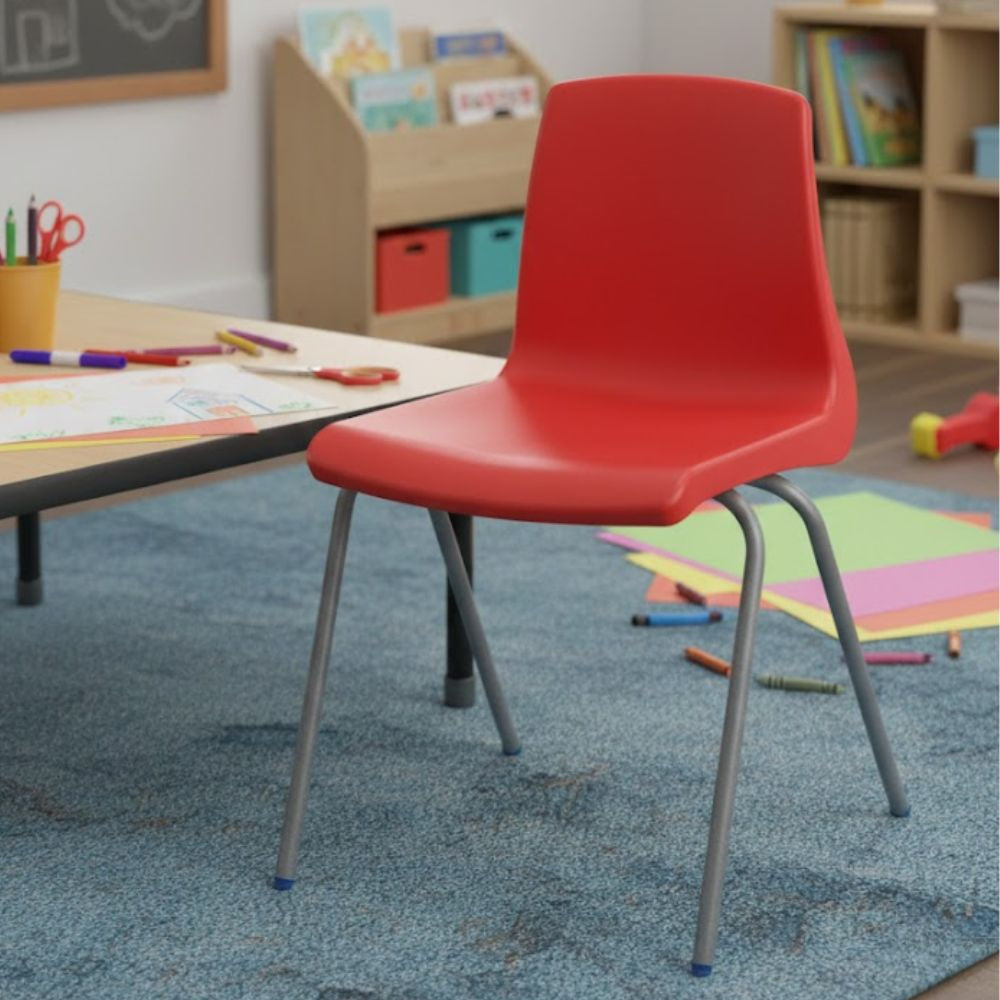 Red plastic chair with metal legs and contoured seat, positioned for early years classroom use.
