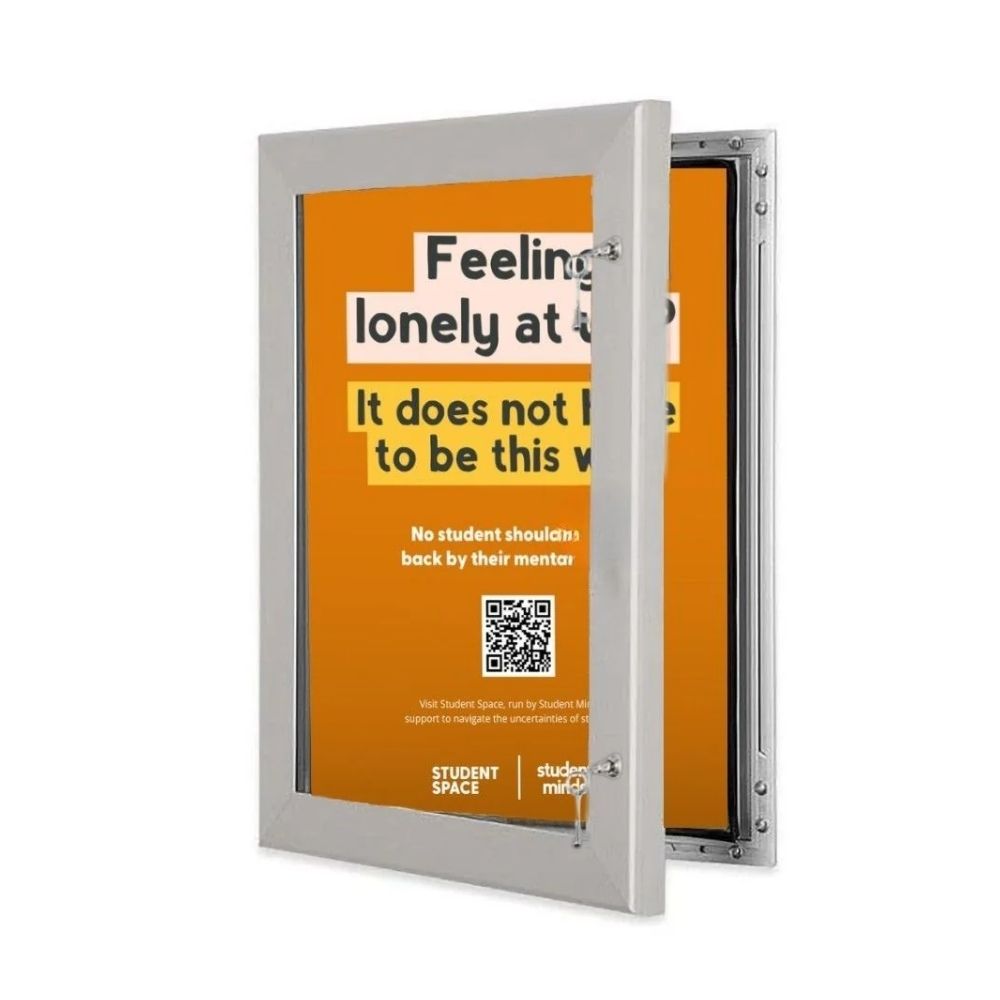 Transparent noticeboard with orange Student Space poster and QR code, designed for campus mental health outreach.