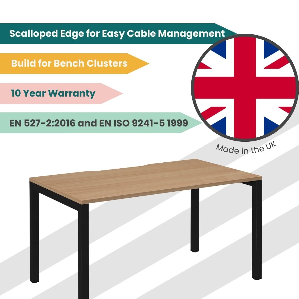 UK-manufactured bench desk with a scalloped rear edge for easy cable management, black frame, and wooden top, designed for bench clusters and compliant with EN 527-2:2016 and EN ISO 9241-5 1999, backed by a 10-year warranty.