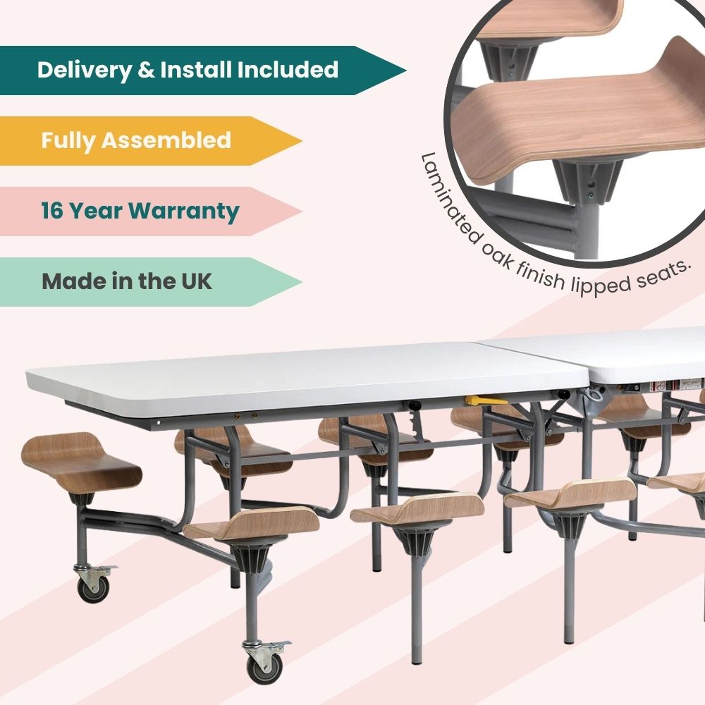 White folding cafeteria table with laminated oak finish lipped seats and grey frame on wheels, fully assembled with delivery and installation included, backed by a 16-year warranty and made in the UK