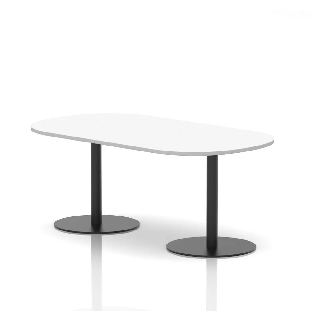 Modern white organic shaped meeting table with two black round pedestal bases in a minimalist studio setting.