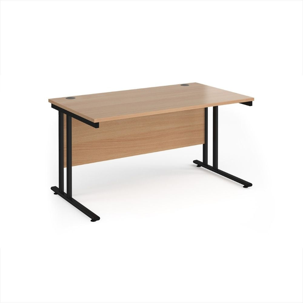 Wide office desk featuring a smooth wood effect desktop, full length modesty screen, twin cable access ports and durable black metal legs for commercial work environments